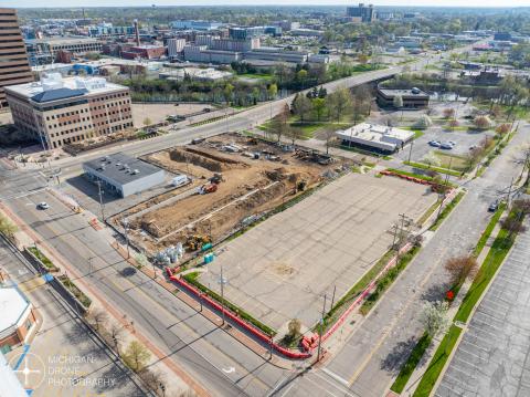 Aerial view of the New Lansing City Hall construction site on 2025-05-08. Riverview 220 is on the left, also under construction.